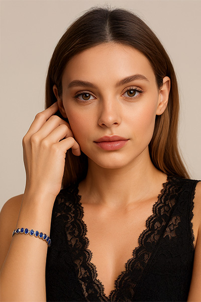 Woman Wearing Blue Stones sparkle in Sterling Silver Bracelet